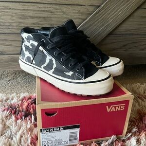 Vans Women’s Black and White Cow Print Mid Sneakers